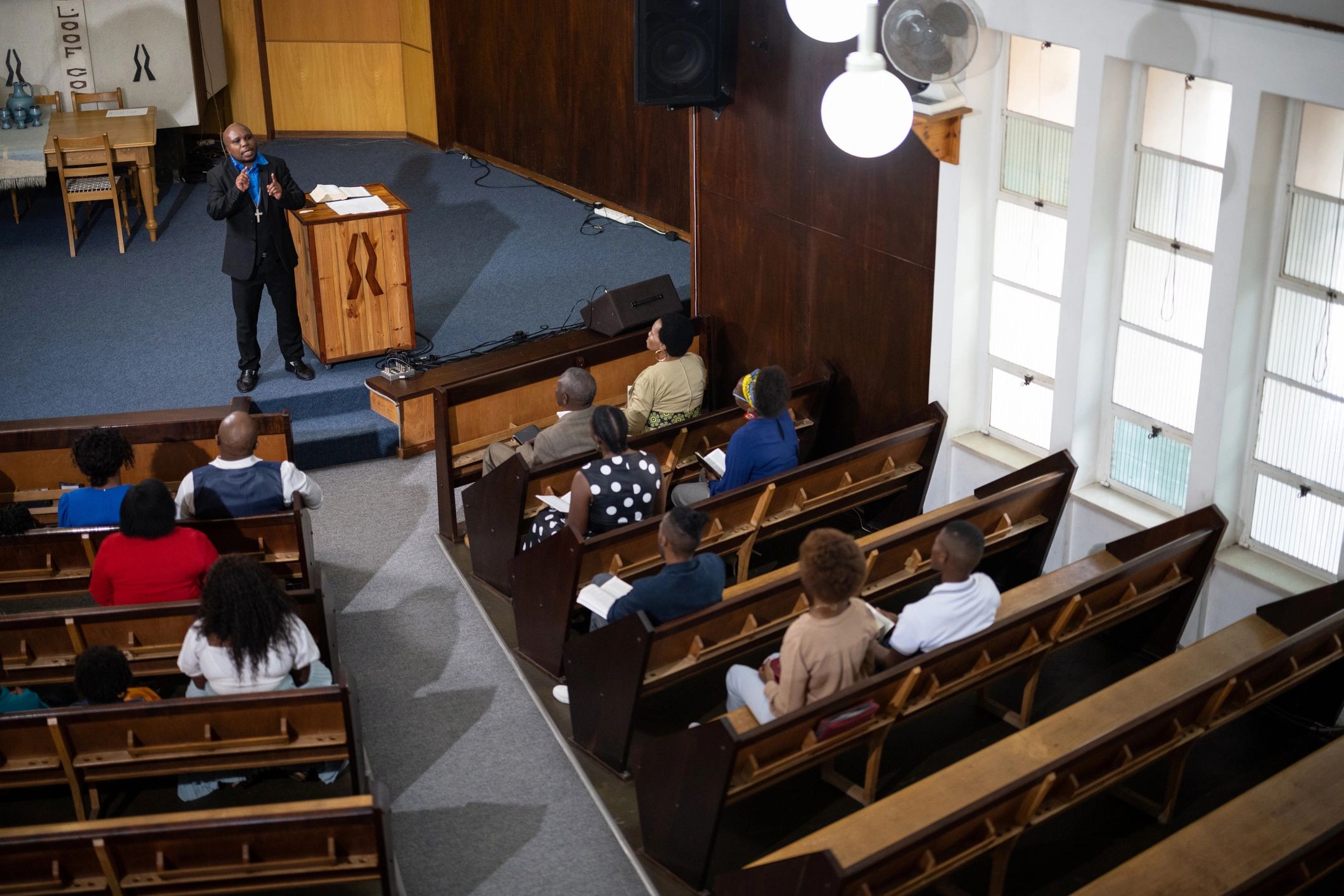 Congregation gathered in prayer during a church service